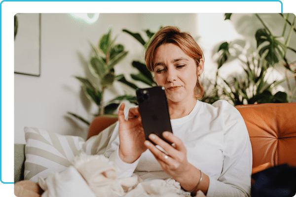 a woman selecting smart home settings on her phone