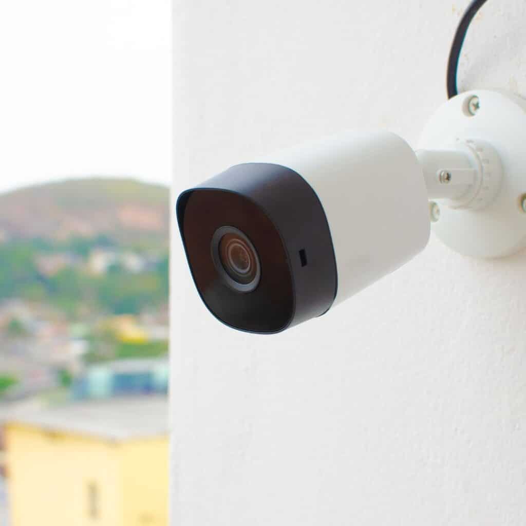 a small white security camera